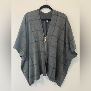 Grey and black poncho with large zipper